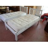 A 3' white bed frame with feather and black shelly 3' mattress