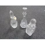 Three crystal decanters with stoppers