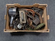 A box of ammunition belts, leather gun bag,