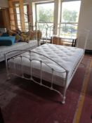 A 5' white metal bed frame with John Lewis Natural collection interior