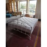 A 5' white metal bed frame with John Lewis Natural collection interior