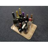 A tray of thirteen bottles of alcohol - Beef eater gin, Capt.
