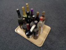 A tray of thirteen bottles of alcohol - Beef eater gin, Capt.