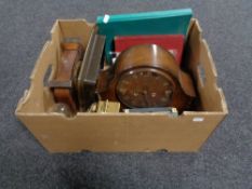 A box of assorted clocks, Hillman workshop manual, miniature pyramid tripod,