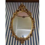 An ornate gilt framed mirror