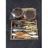 A tray of boxed an unboxed cutlery, plated Art Deco cake slice,