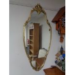 A decorative gilt framed mirror