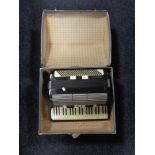 A Carmen III M accordion in case