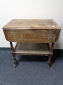 An oak two tier trolley