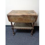 An oak two tier trolley