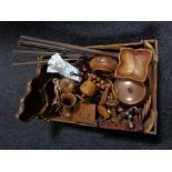A box containing wooden items; nut bowls, pipe rack, comport,