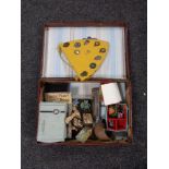 A vintage leather case containing miscellany to include costume jewellery, harmonica, treen barrel,