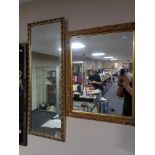 A gilt framed hall mirror together with one other gilt framed mirror