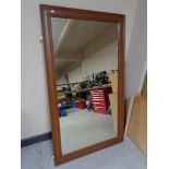 An oak framed wall mirror