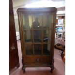 An early 20th century continental oak display cabinet