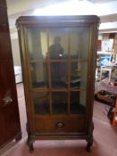 An early 20th century continental oak display cabinet