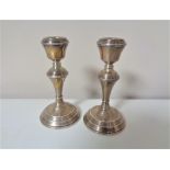 A pair of small silver candlesticks, height 14 cm.