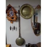 A brass bed warming pan and an embossed brass bowl