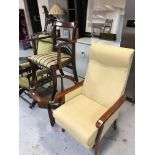 A fireside chair and a Regency style armchair