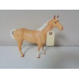 A Beswick tan matte glaze horse.