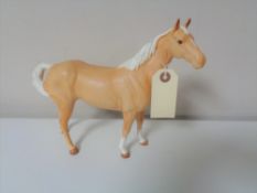 A Beswick tan matte glaze horse.