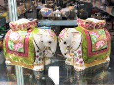 A pair of Royal Crown Derby Mother Indian Elephant paperweights with stoppers