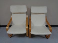 A pair of beech framed Ikea relaxer chairs