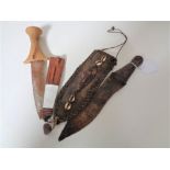 Two African knives, one with carved 'head' terminal.