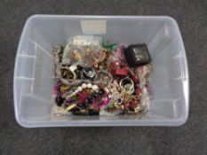 A plastic tub of a large quantity of assorted costume jewellery