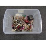 A plastic tub of a large quantity of assorted costume jewellery