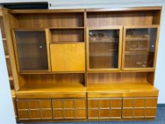A mid 20th century teak twin section bureau bookcase