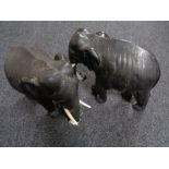 A pair of early 20th century carved eastern figures of elephants