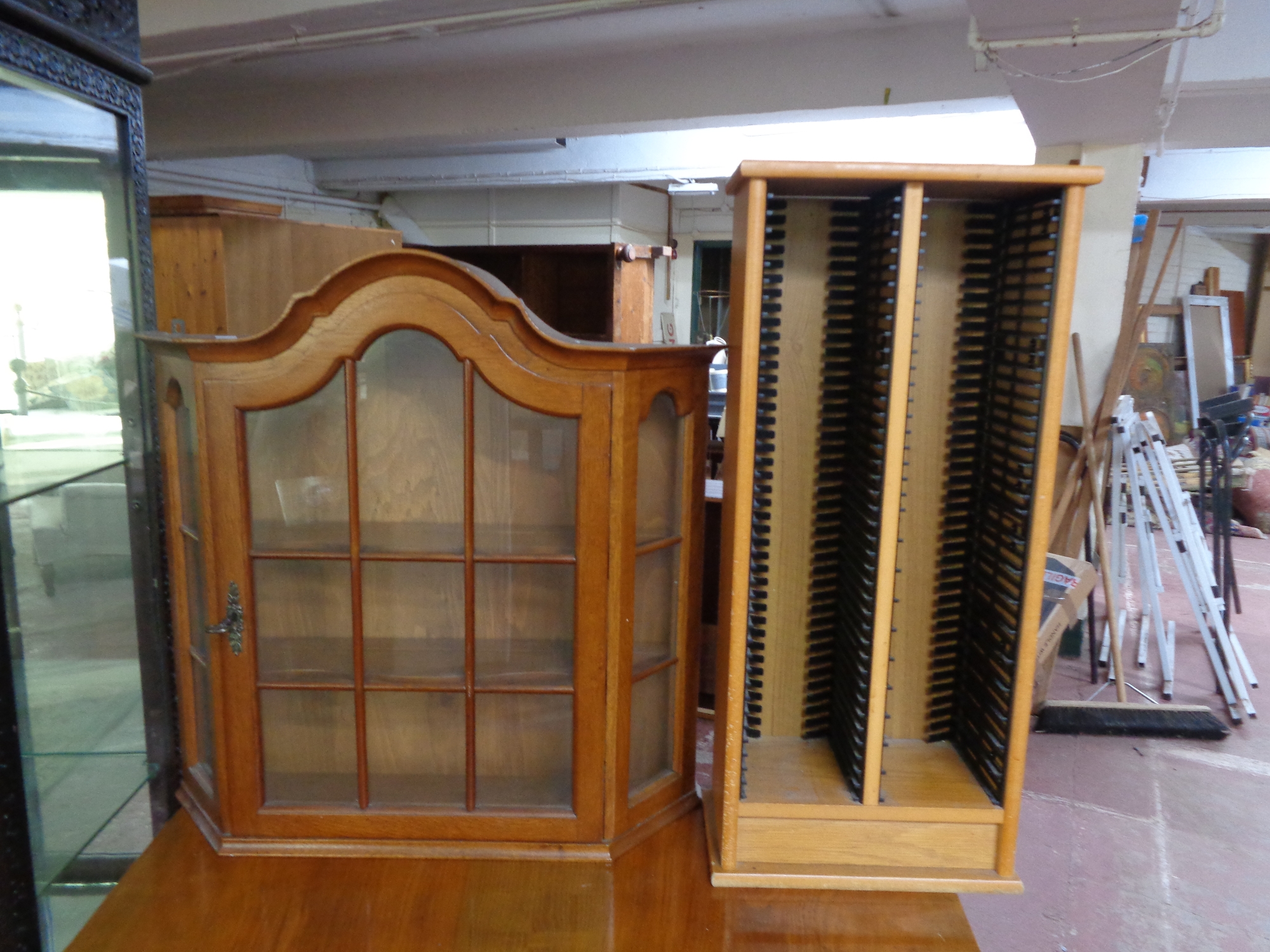 A continental single door wall cabinet and CD rack