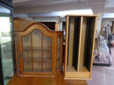 A continental single door wall cabinet and CD rack