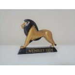 A Kew & Brockley metal figure - Wembley Lion 1924 CONDITION REPORT: 8cm long by 2cm