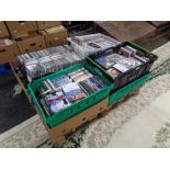 A pallet of nine boxes of assorted DVD's and CD's