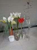 A quantity of glass vases with artificial flowers