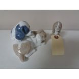 A Lladro and Nao figure group - dogs