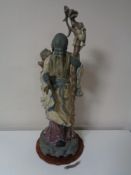 A large Lladro figure of a Japanese elder in matte glaze,