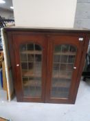 A Victorian glazed double door bookcase