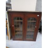 A Victorian glazed double door bookcase