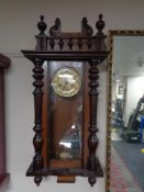 An early 20th century Junghans eight day wall clock with pendulum and key