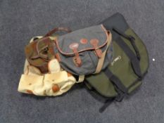 A box containing Barbour fishing bag and three others