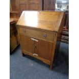 A 1930's oak writing bureau