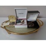 A twin handled dressing table tray together with a small quantity of costume jewellery,