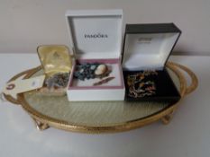 A twin handled dressing table tray together with a small quantity of costume jewellery,