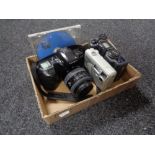 A box of cameras to include Minolta Dynax 500SI with lens, Nikon Coolpix 995,