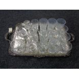 A silver plated twin handled serving tray together with glass ware, whisky tumblers,