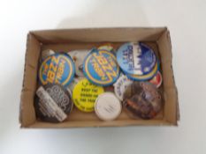 A box containing 20th century pin badges relating to railways