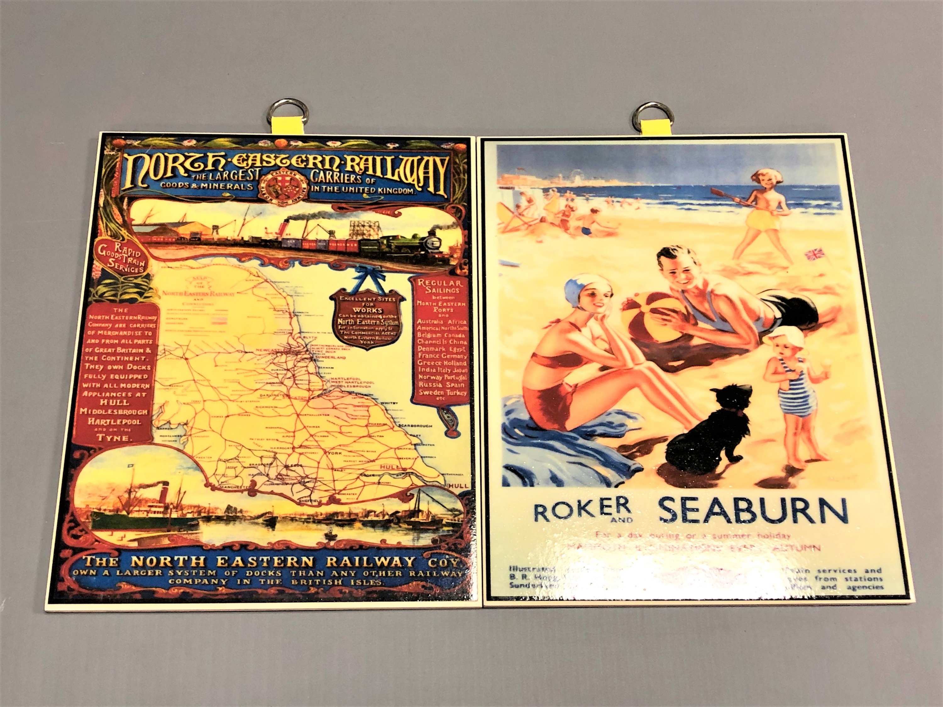 Two reproduction porcelain railway plaques; British Railways and North Eastern Railways.